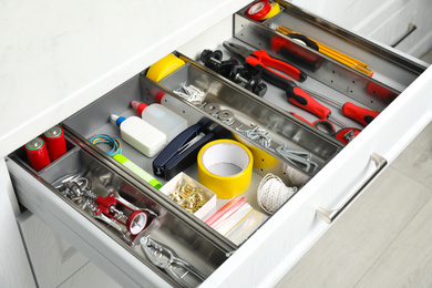 Photo of Set of instruments in open desk drawer indoors