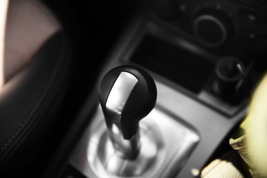 Photo of Closeup view of gear stick in modern car