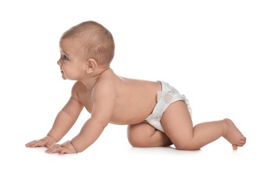 Photo of Cute little baby in diaper crawling on white background