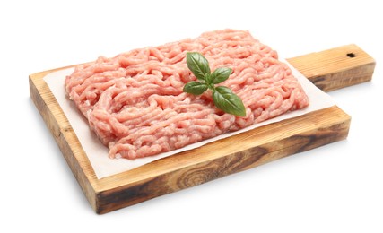 Photo of Raw chicken minced meat with basil on white background