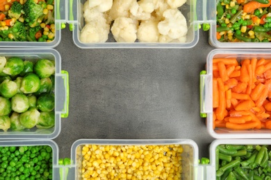 Photo of Flat lay composition with frozen vegetables on grey background