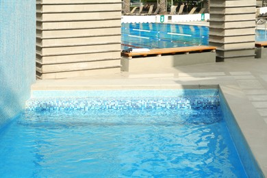 Photo of Outdoor swimming pool with stairs and clear water