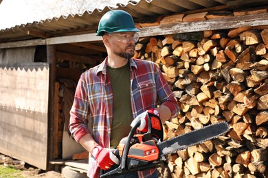 Photo of Man with modern saw on sunny day