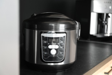 Photo of Modern multi cooker in kitchen. Domestic appliance