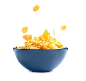 Photo of Crispy cornflakes falling into bowl on white background