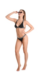 Photo of Pretty sexy woman in stylish bikini with sunglasses on white background
