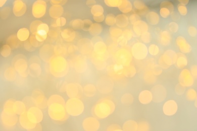 Gold glitter with bokeh effect on light background