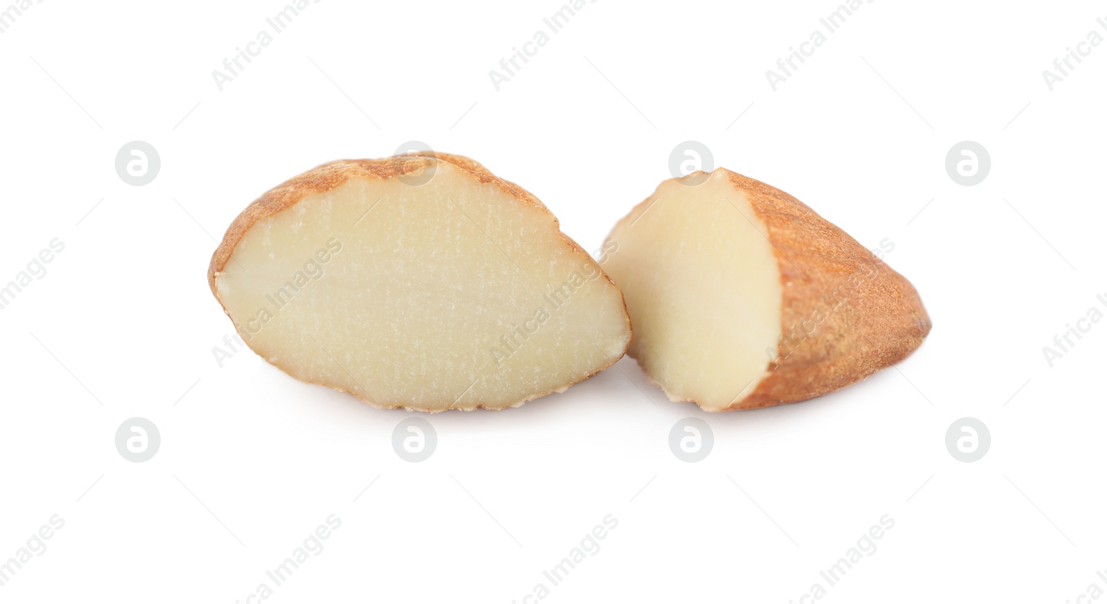 Photo of Halves of organic almond nut isolated on white, closeup. Healthy snack