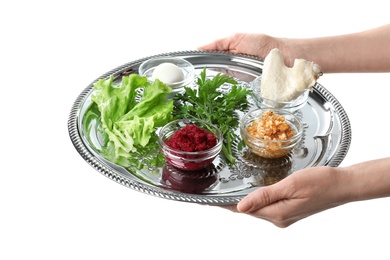 Woman holding traditional Passover (Pesach) Seder plate plate with symbolic meal on white background, closeup