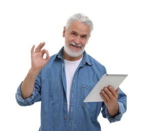 Man with tablet showing ok gesture on white background