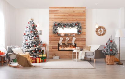 Photo of Beautiful Christmas interior of living room with decorated tree