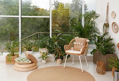 Photo of Room interior with stylish furniture and green plants