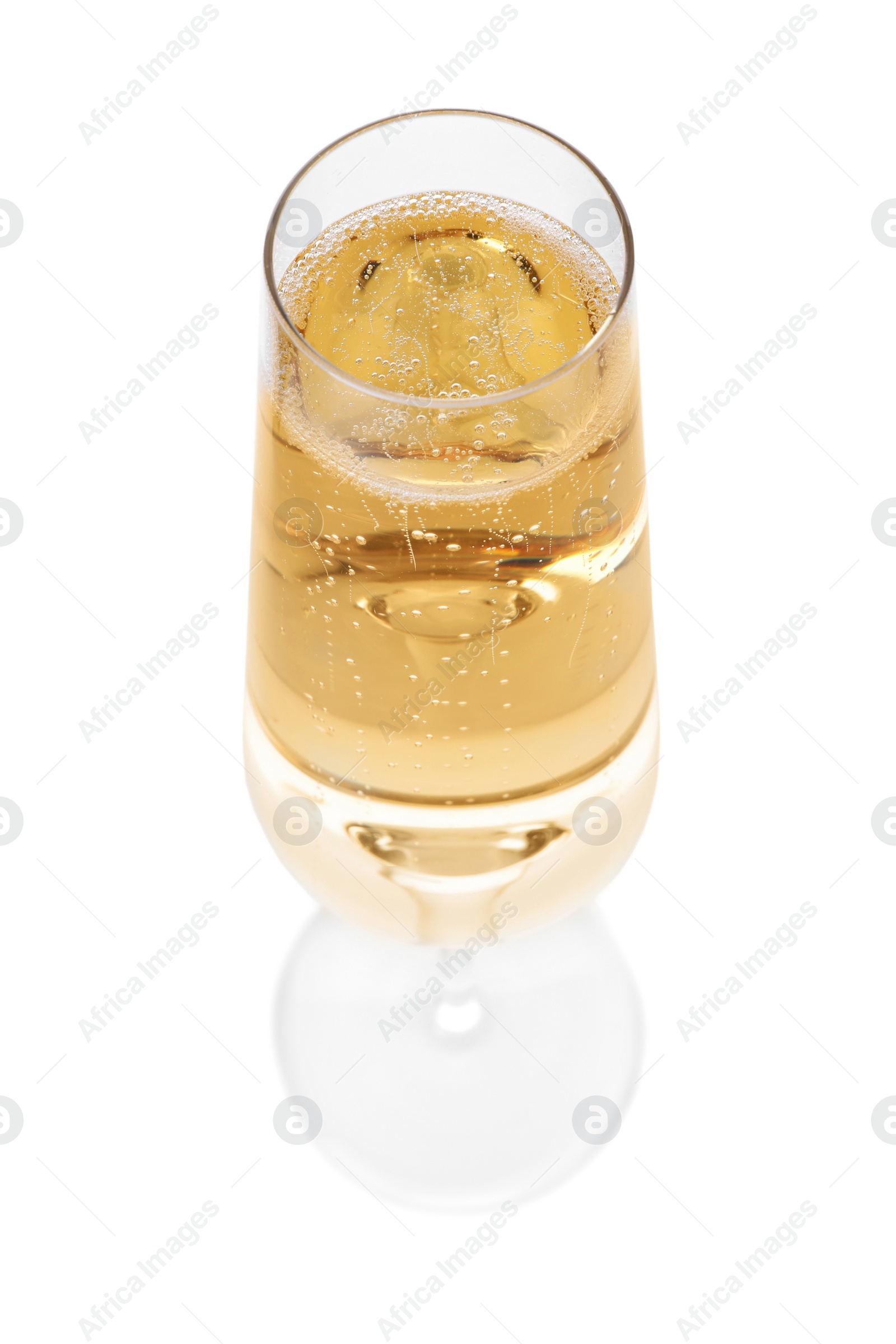 Photo of Glass of champagne on white background. Festive drink