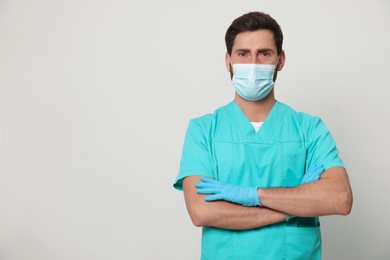 Photo of Nurse with medical mask on white background, space for text