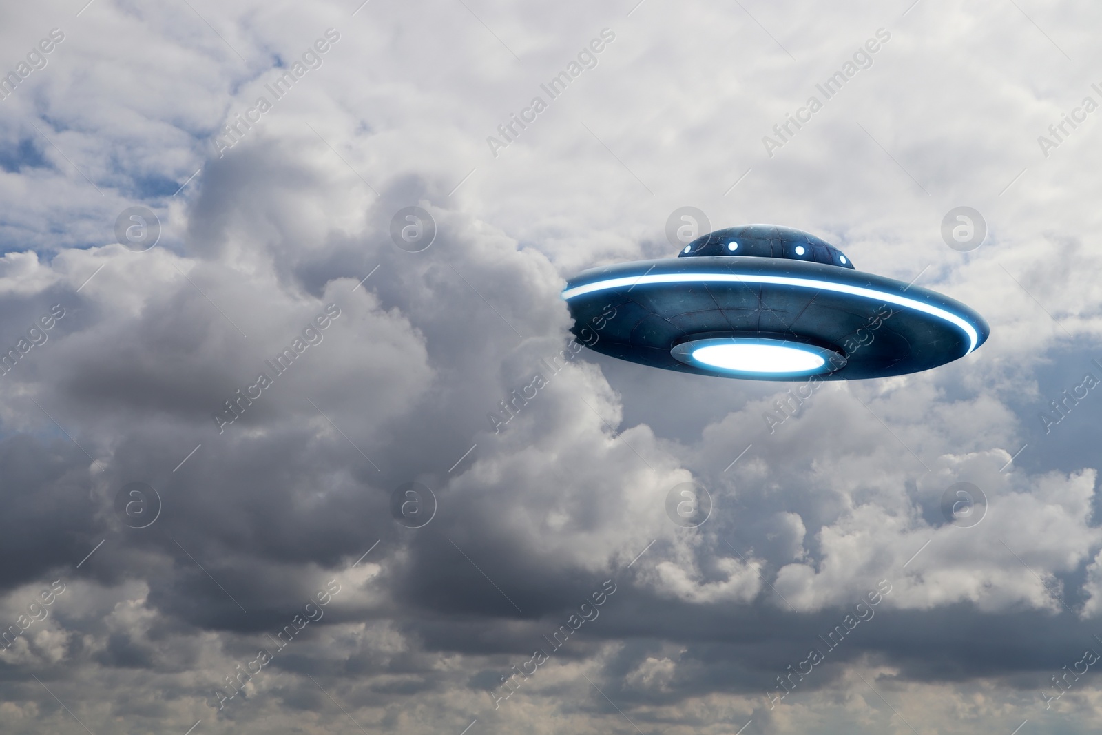 Image of UFO. Alien spaceship among clouds in sky. Extraterrestrial visitors