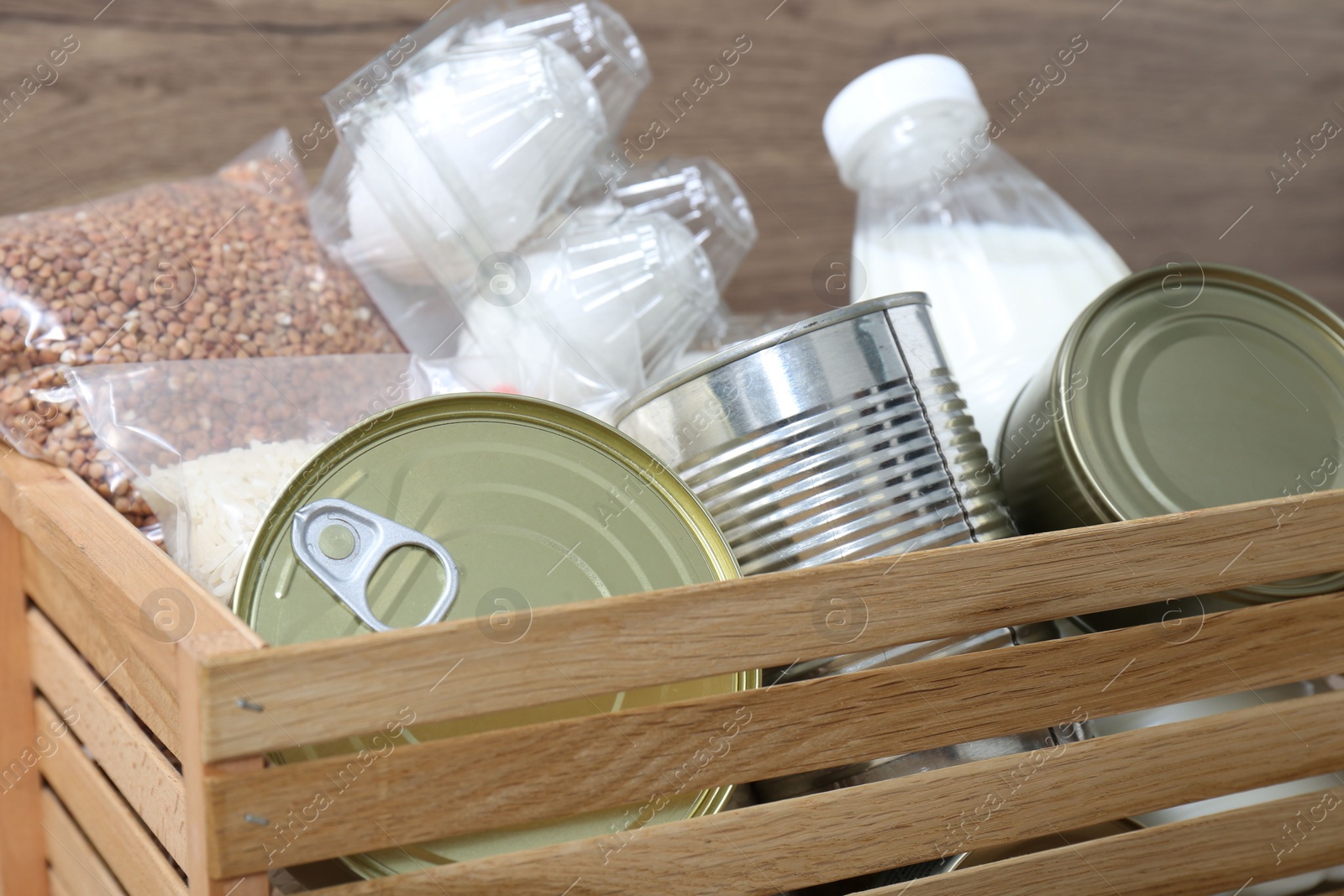 Photo of Donation box with different food products, closeup