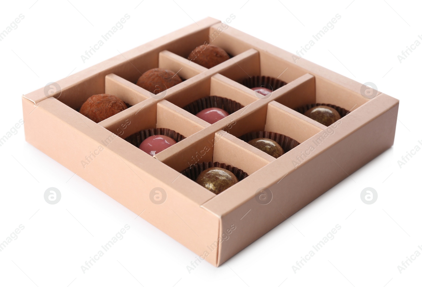 Photo of Delicious chocolate candies in box on white background