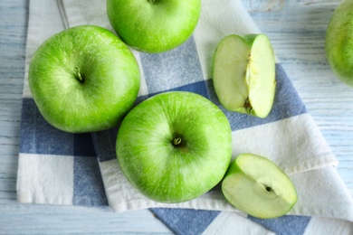 Photo of Fresh green apples on wooden table