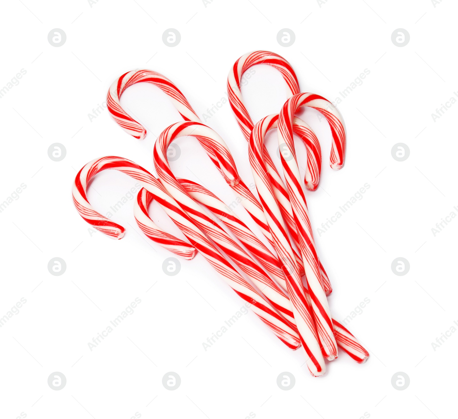 Photo of Tasty candy canes on white background. Festive treat