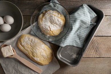Photo of Raw dough, eggs and flour on wooden table, flat lay. Cooking ciabatta