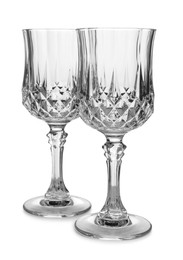 Photo of Elegant clean empty wine glasses isolated on white