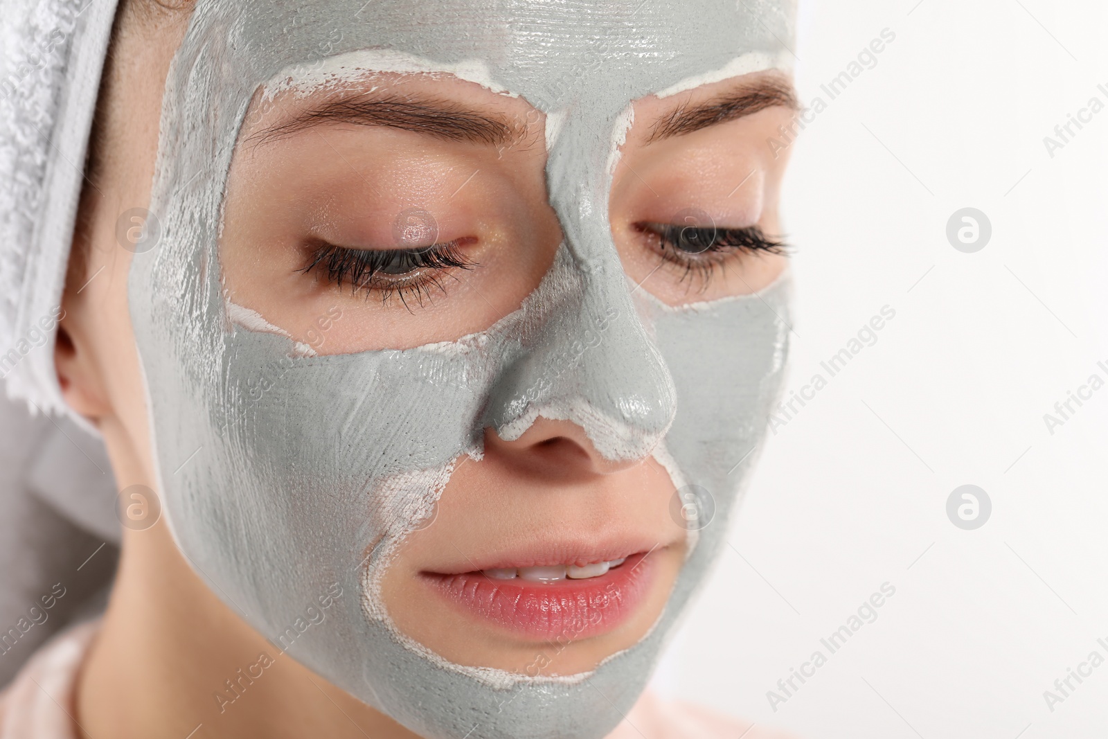 Photo of Woman with face mask on white background, closeup and space for text. Spa treatments