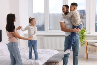 Photo of Happy international family spending time together at home