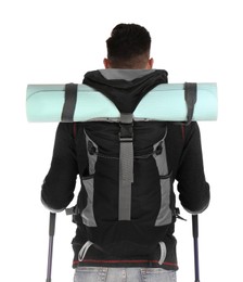 Male hiker with backpack and trekking poles on white background, back view