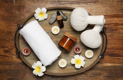 Composition with different spa products on wooden table, top view