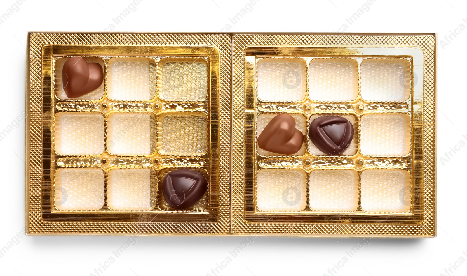 Photo of Partially empty box of chocolate candies isolated on white, top view