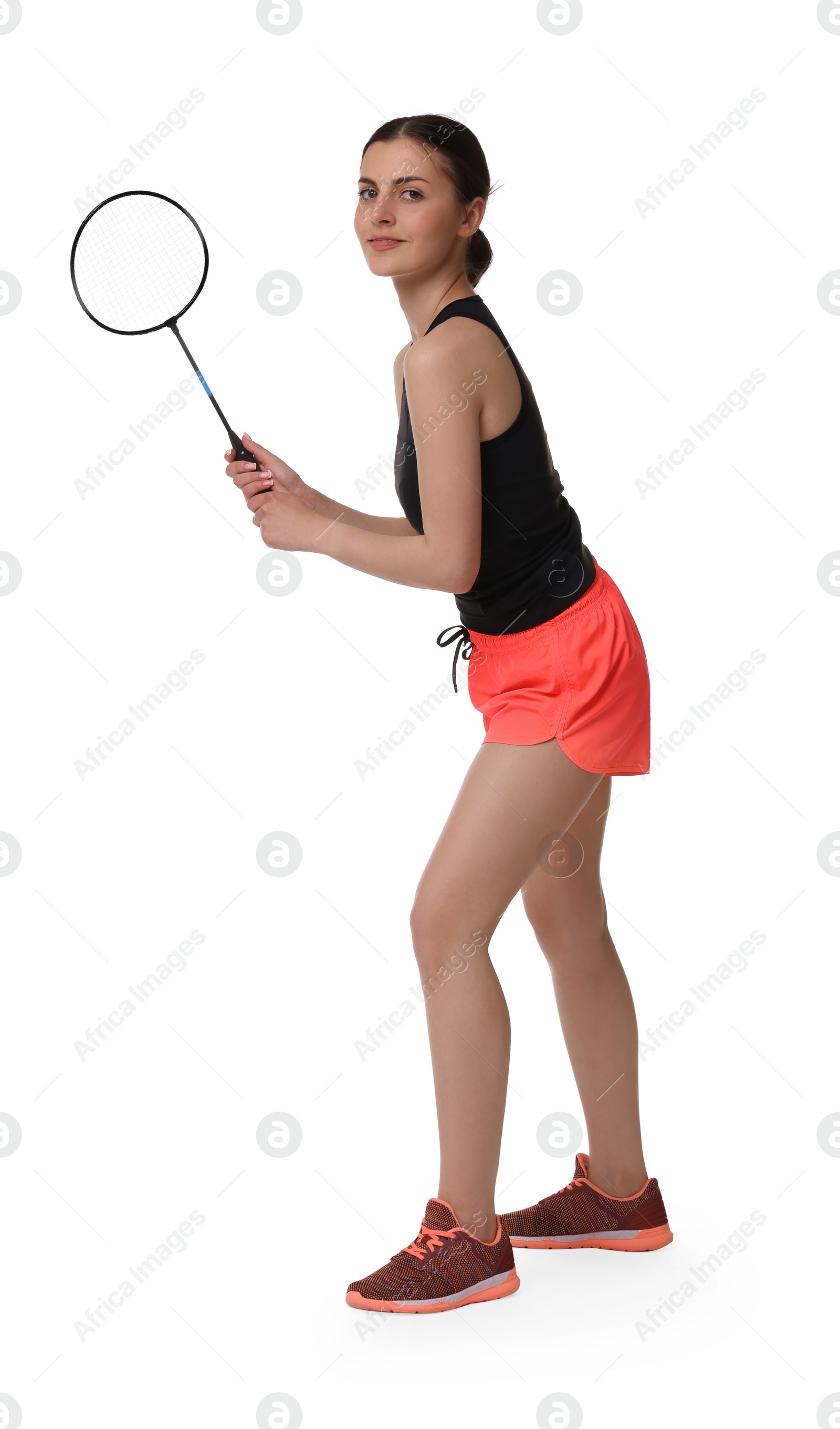 Photo of Young woman playing badminton with racket on white background