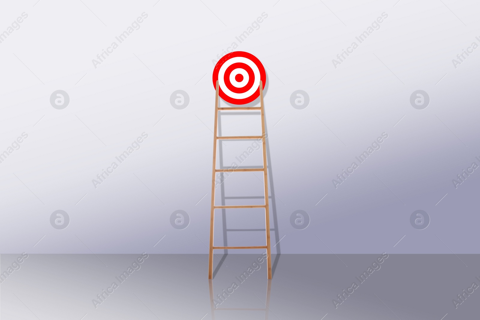 Image of Target and achievement concept. Wooden ladder leading to bullseye near wall