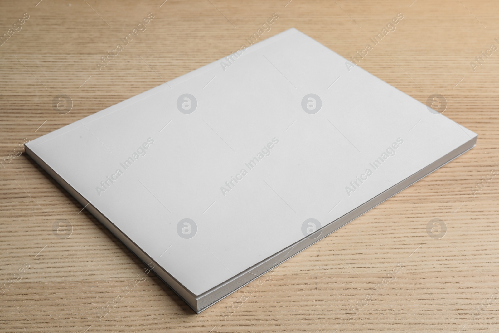 Photo of Brochure with blank cover on wooden background. Mock up for design