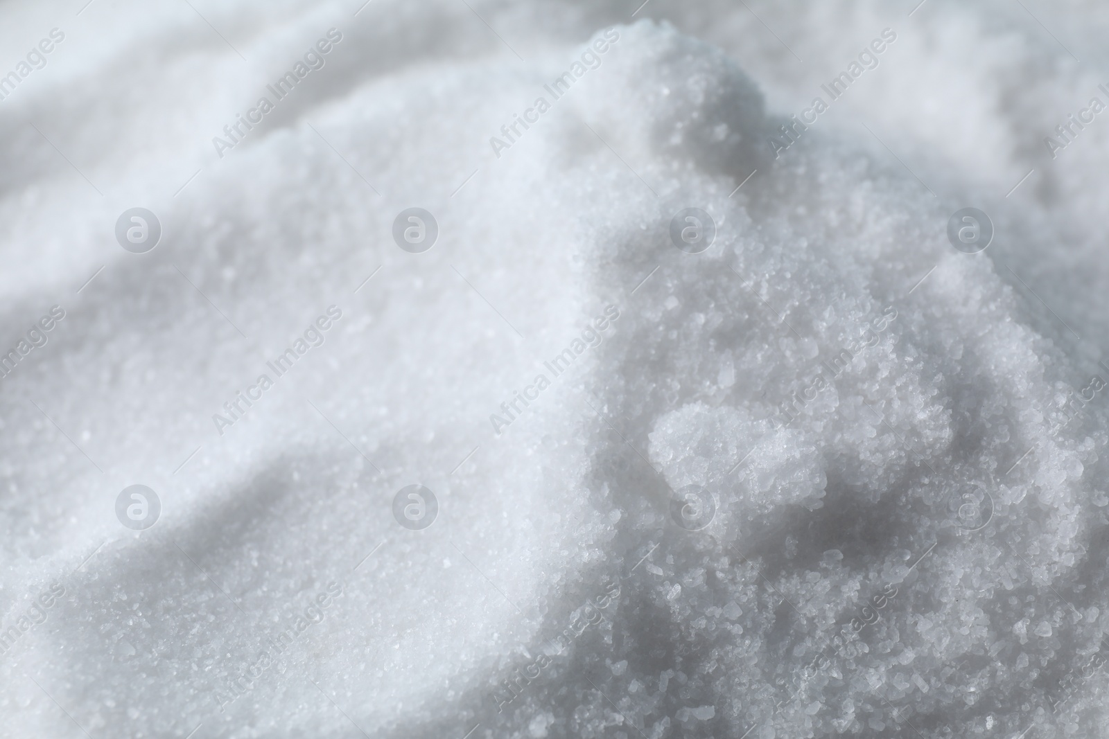 Photo of Organic white sea salt as background, closeup