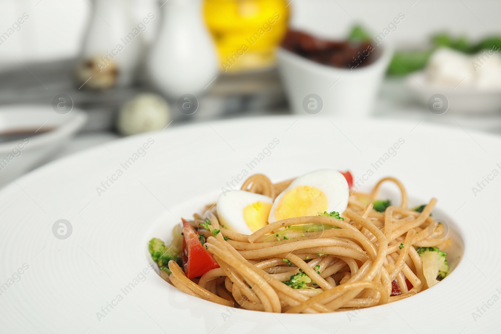 Photo of Tasty buckwheat noodles in plate on table, closeup