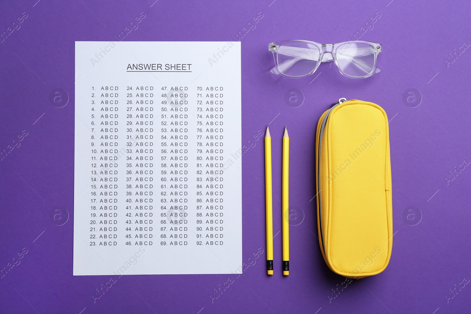 Photo of Flat lay composition with answer sheet on color background