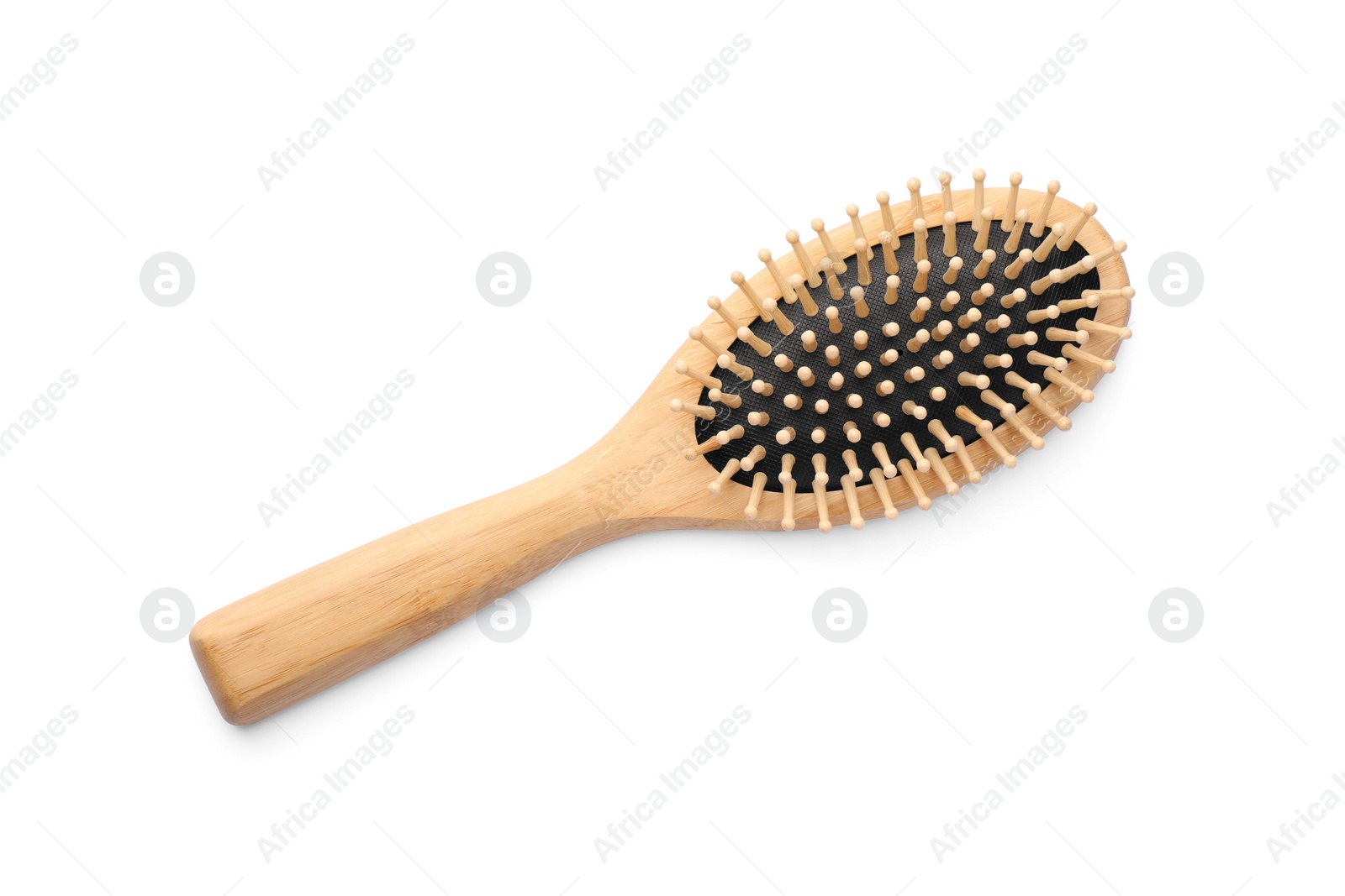 Photo of New wooden hair brush isolated on white, top view