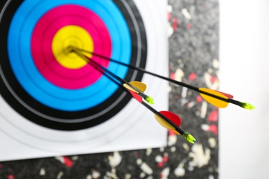 Three arrows in archery target, closeup view