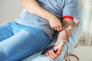 Man donating blood to save someone's life in hospital