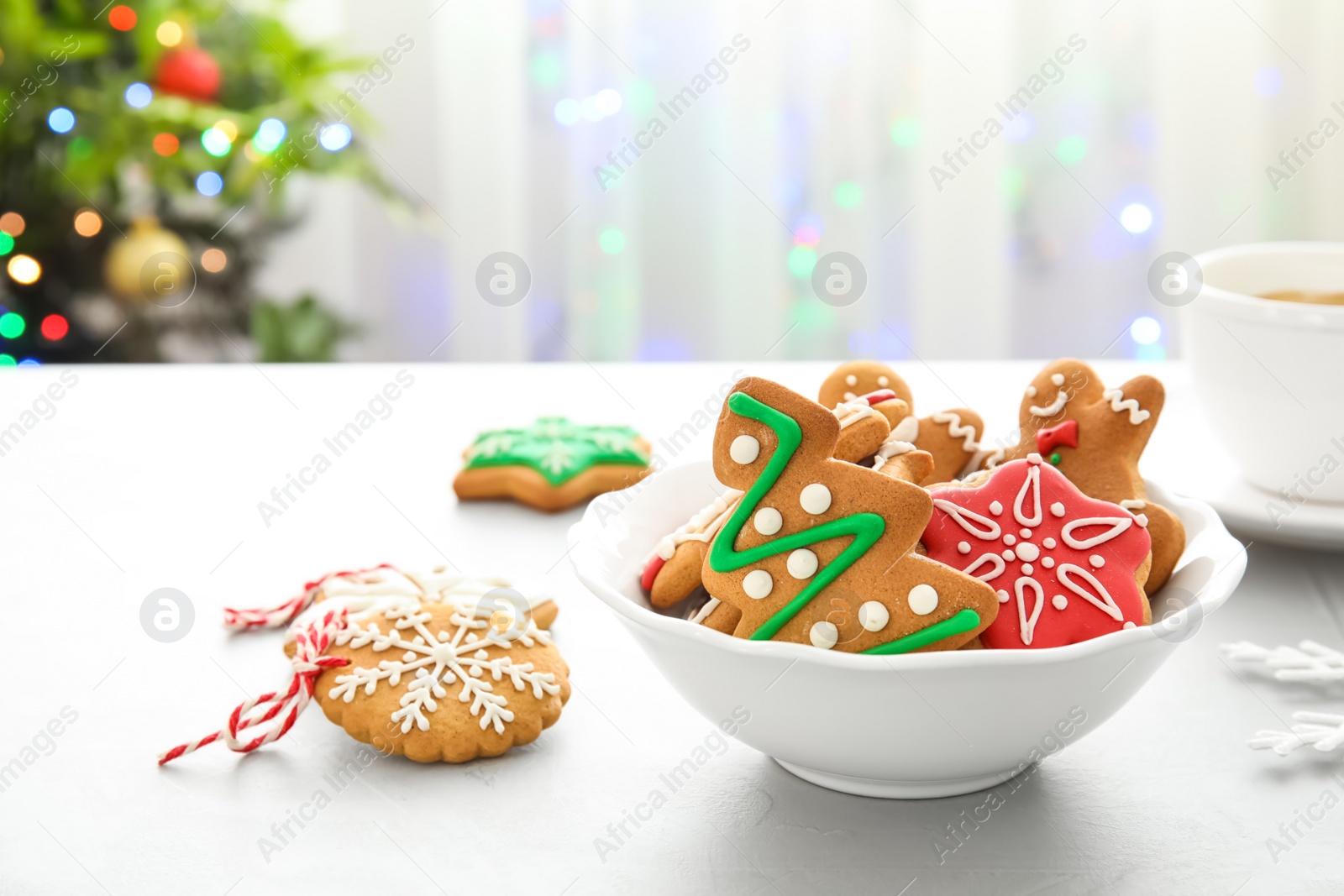 Photo of Plate with tasty homemade Christmas cookies on table