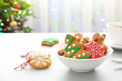 Photo of Plate with tasty homemade Christmas cookies on table