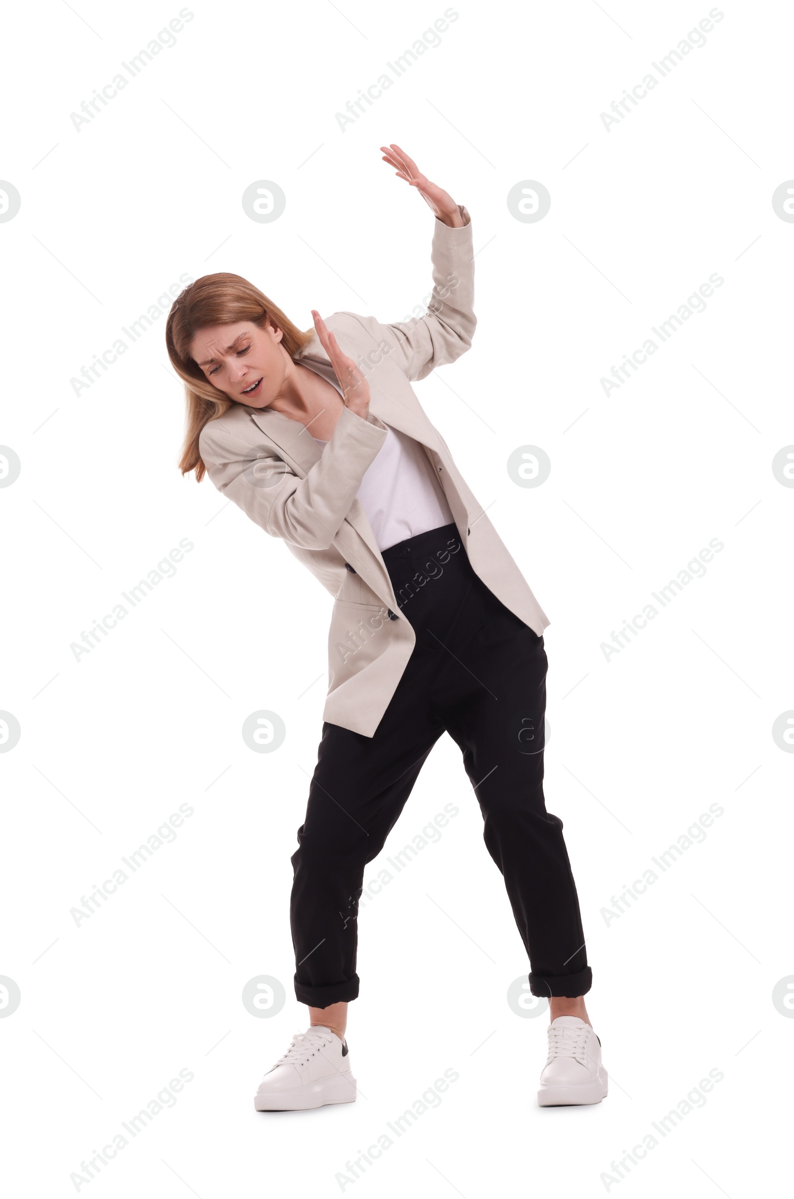 Photo of Beautiful businesswoman avoiding something on white background