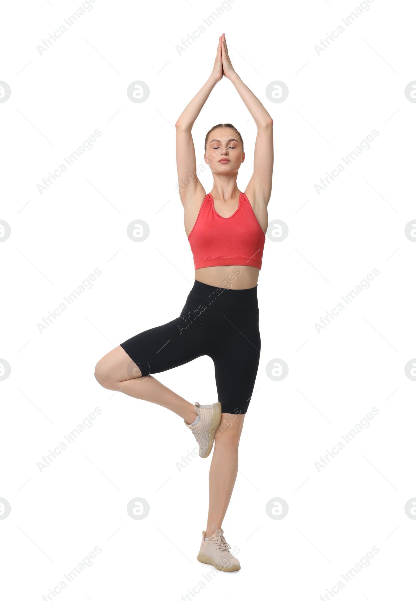 Photo of Young woman practicing yoga on white background