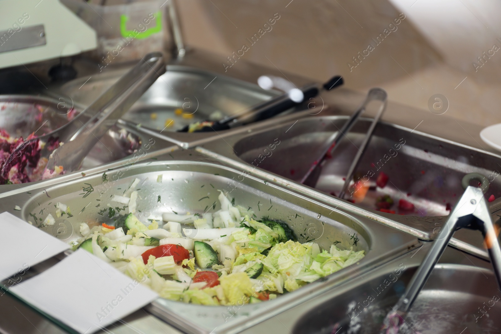 Photo of Containers with tasty food in school canteen