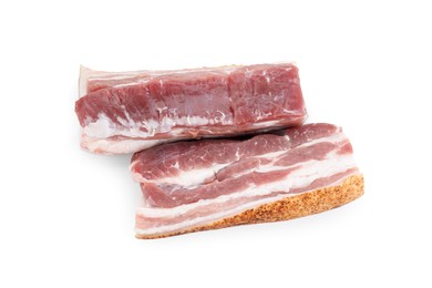 Photo of Pieces of raw pork belly isolated on white, top view