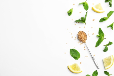 Fresh mint with sliced lemon and sugar on white background, flat lay