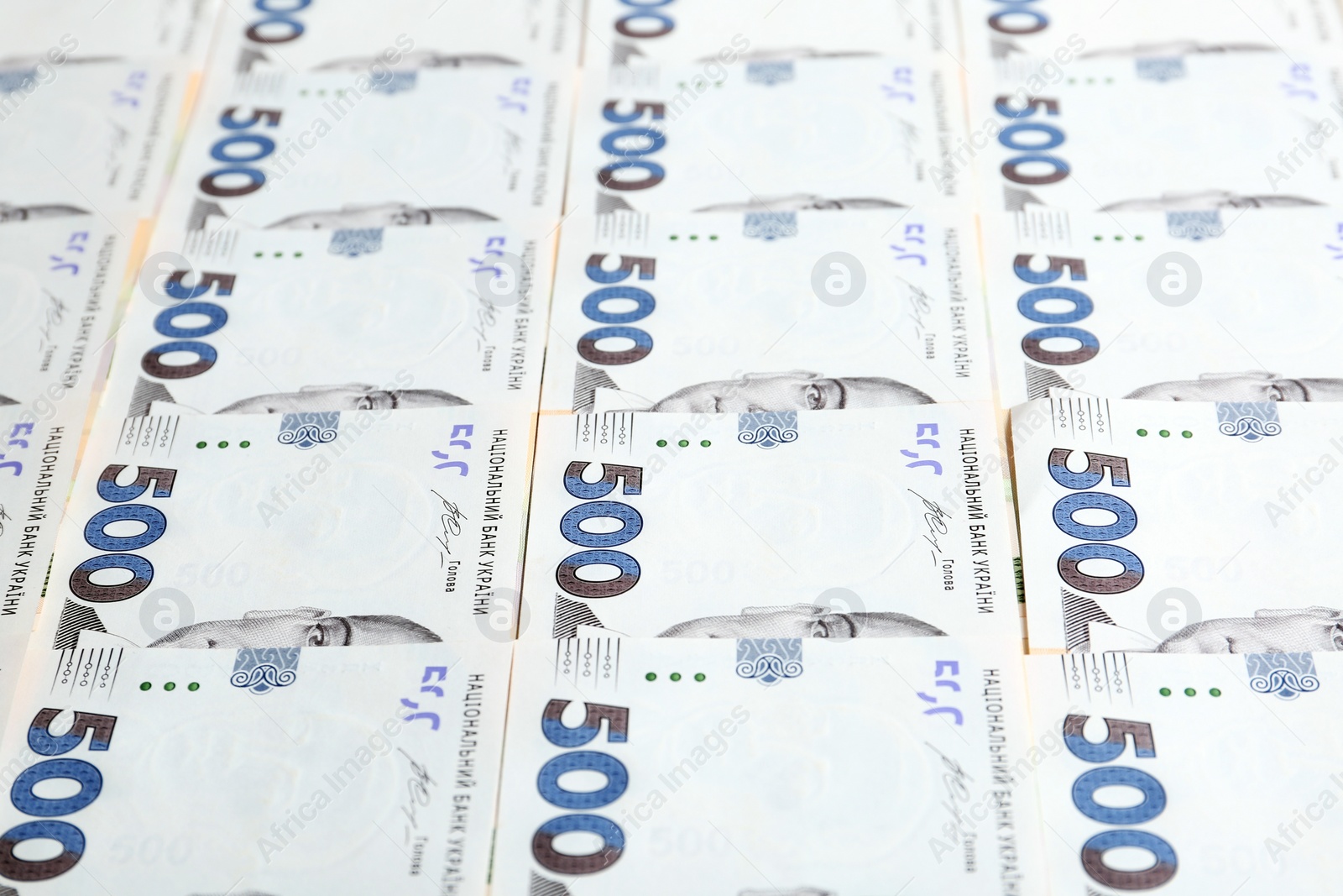 Photo of Closeup view of Ukrainian money as background. National currency