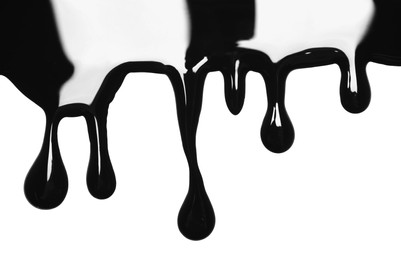 Photo of Black glossy paint spilled on white background, top view