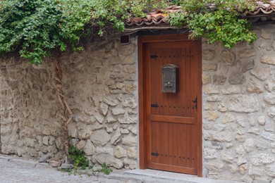 Entrance of house with beautiful wooden door