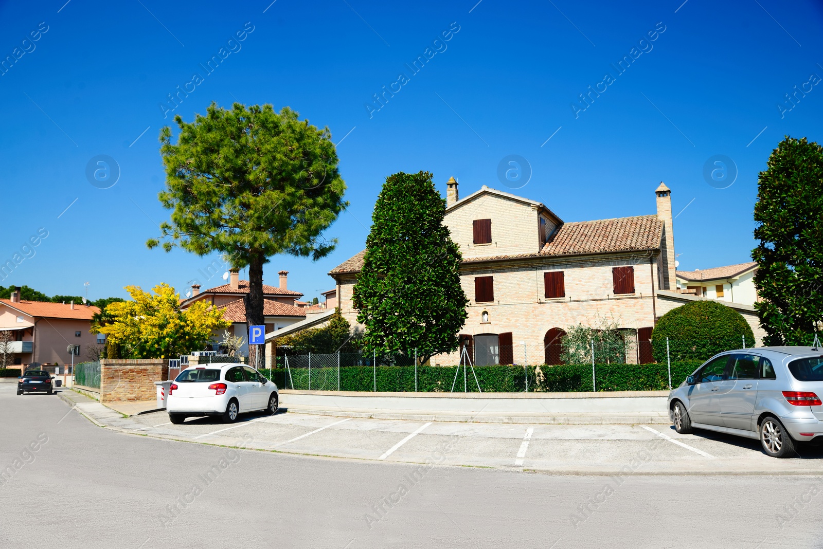 Photo of Picturesque view of city street with beautiful buildings on sunny day